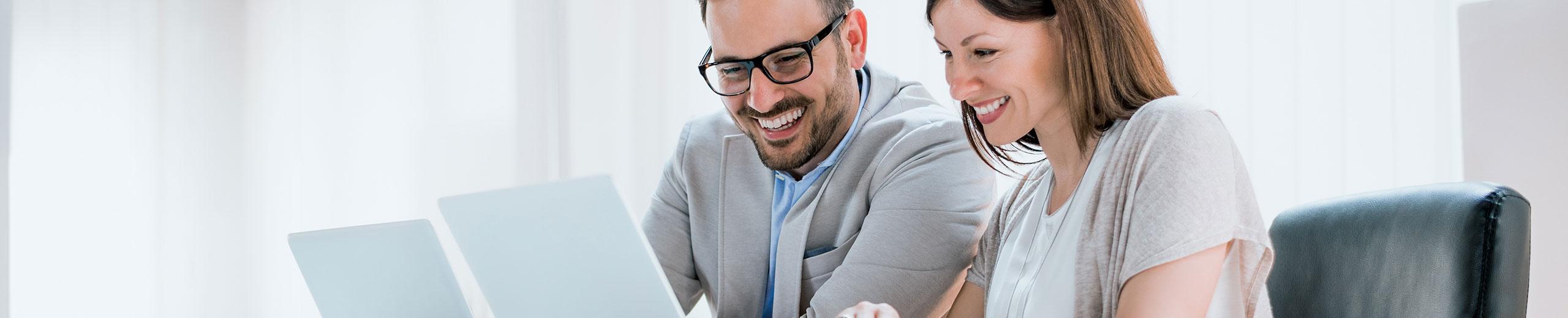 Young professionals in front of a computer