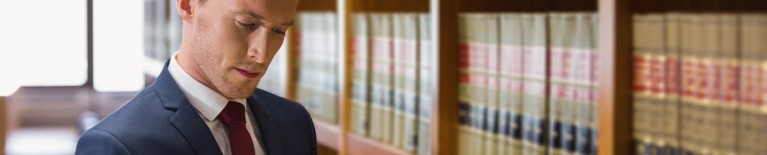 Handsome lawyer in the law library at the university