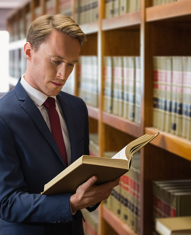Handsome lawyer in the law library at the university