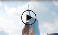 A woman in front of the UniCredit Tower