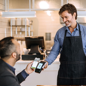A man paying with Apple Pay