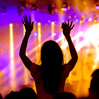People dancing at an open-air concert